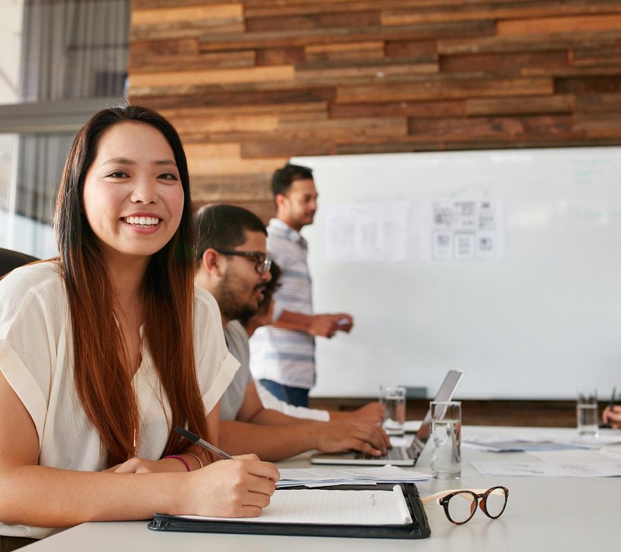 asian-woman-smiling-during-business-presentation-P2TRSSV.jpg